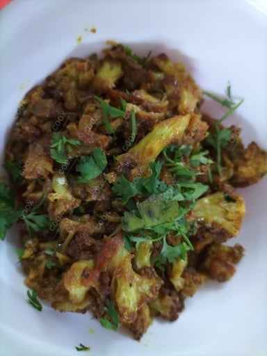 Tasty Adraki Gobhi cooked by COOX chefs cooks during occasions parties events at home