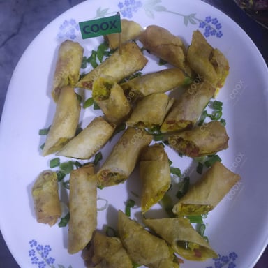Tasty Veg Spring Rolls cooked by COOX chefs cooks during occasions parties events at home
