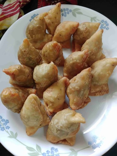 Tasty Keema Samosas cooked by COOX chefs cooks during occasions parties events at home