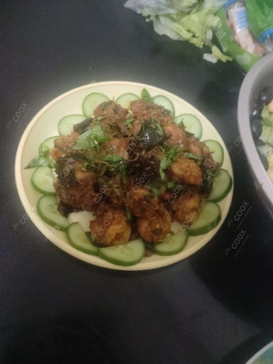 Tasty Red Chilli Prawns cooked by COOX chefs cooks during occasions parties events at home