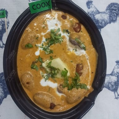 Tasty Malai Kofta (Orange Gravy) cooked by COOX chefs cooks during occasions parties events at home