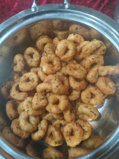 Tasty Medu Vada cooked by COOX chefs cooks during occasions parties events at home