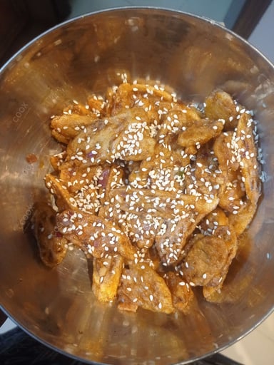 Tasty Chilli Lotus Stem cooked by COOX chefs cooks during occasions parties events at home