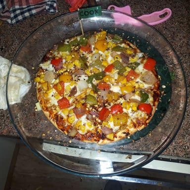 Tasty Veg Pizza cooked by COOX chefs cooks during occasions parties events at home