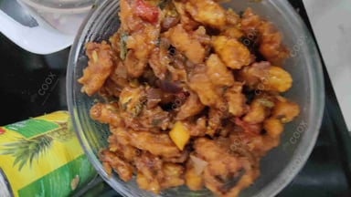 Tasty Crispy Chilli Baby Corn cooked by COOX chefs cooks during occasions parties events at home
