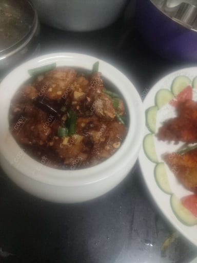Tasty Chicken In Burnt Garlic Sauce cooked by COOX chefs cooks during occasions parties events at home
