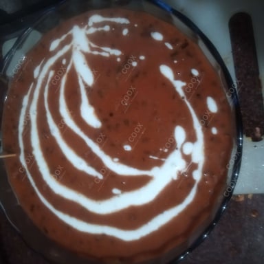 Tasty Dal Makhni cooked by COOX chefs cooks during occasions parties events at home