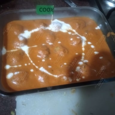 Tasty Malai Kofta (Orange Gravy) cooked by COOX chefs cooks during occasions parties events at home
