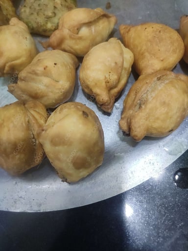 Tasty Keema Samosas cooked by COOX chefs cooks during occasions parties events at home