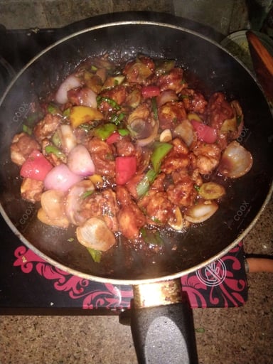 Tasty Chilli Chicken cooked by COOX chefs cooks during occasions parties events at home