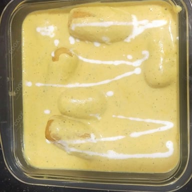 Tasty Malai Kofta (Orange Gravy) cooked by COOX chefs cooks during occasions parties events at home