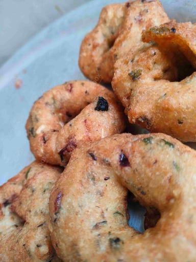 Tasty Medu Vada cooked by COOX chefs cooks during occasions parties events at home