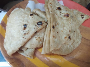 Tasty Tawa Rotis cooked by COOX chefs cooks during occasions parties events at home
