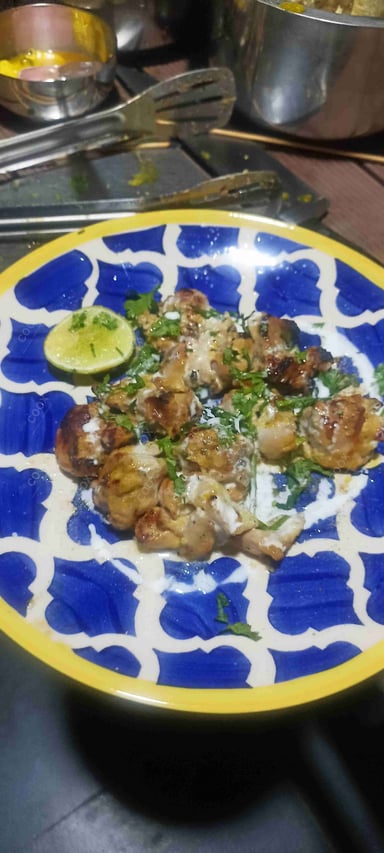 Tasty Murgh Malai Tikka cooked by COOX chefs cooks during occasions parties events at home