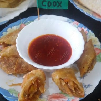 Tasty Veg Spring Rolls cooked by COOX chefs cooks during occasions parties events at home