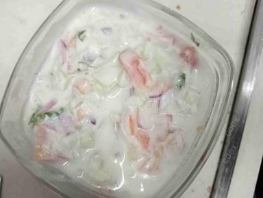 Tasty Cucumber Raita cooked by COOX chefs cooks during occasions parties events at home