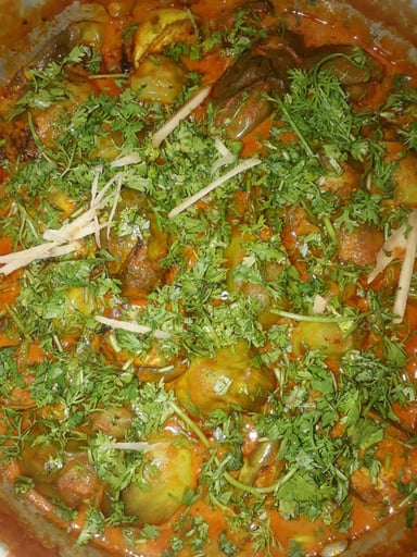 Tasty Baigan Ka Khatta cooked by COOX chefs cooks during occasions parties events at home