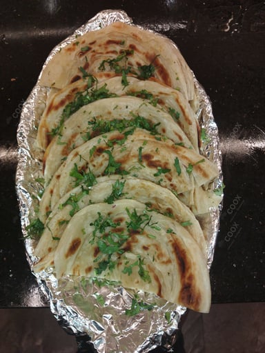 Tasty Malabar Parotta cooked by COOX chefs cooks during occasions parties events at home