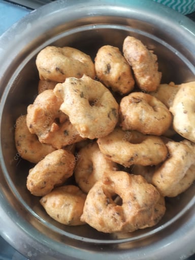 Tasty Medu Vada cooked by COOX chefs cooks during occasions parties events at home