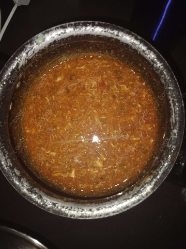 Tasty Chicken Manchow Soup cooked by COOX chefs cooks during occasions parties events at home