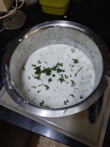 Tasty Cucumber Raita cooked by COOX chefs cooks during occasions parties events at home
