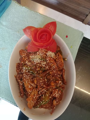 Tasty Chilli Lotus Stem cooked by COOX chefs cooks during occasions parties events at home