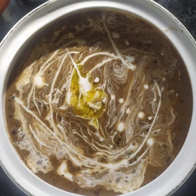 Tasty Dal Makhni cooked by COOX chefs cooks during occasions parties events at home