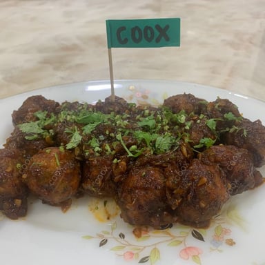 Tasty Veg Manchurian (Gravy) cooked by COOX chefs cooks during occasions parties events at home