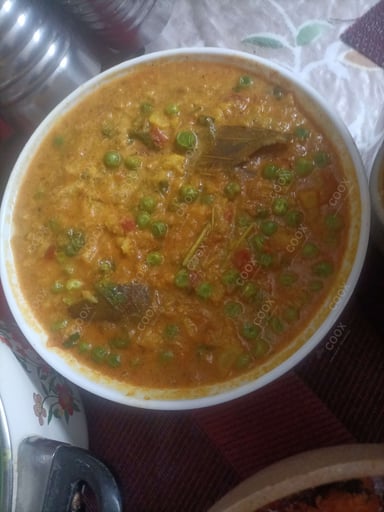 Tasty Gobhi Matar cooked by COOX chefs cooks during occasions parties events at home