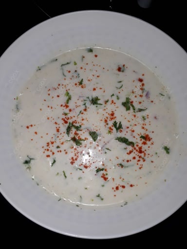 Tasty Cucumber Raita cooked by COOX chefs cooks during occasions parties events at home