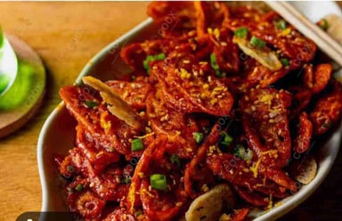 Tasty Chilli Lotus Stem cooked by COOX chefs cooks during occasions parties events at home