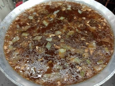 Tasty Chicken Manchow Soup cooked by COOX chefs cooks during occasions parties events at home