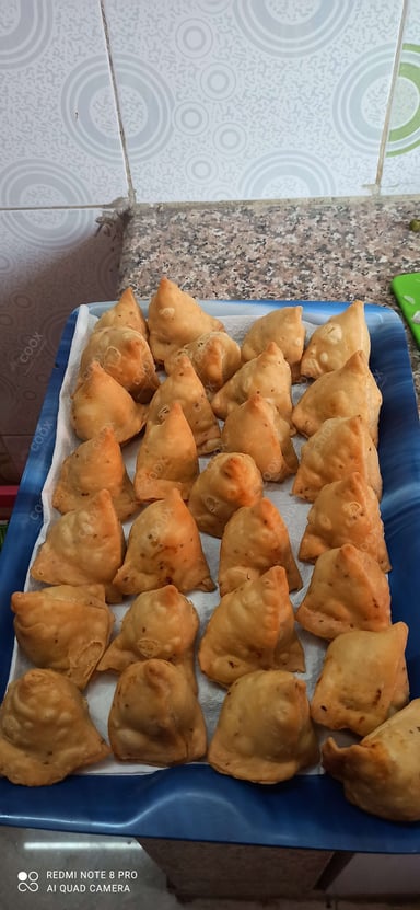 Tasty Mini Samosas cooked by COOX chefs cooks during occasions parties events at home