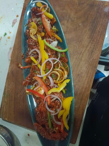 Tasty Chilli Lotus Stem cooked by COOX chefs cooks during occasions parties events at home