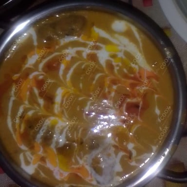 Tasty Malai Kofta (Orange Gravy) cooked by COOX chefs cooks during occasions parties events at home