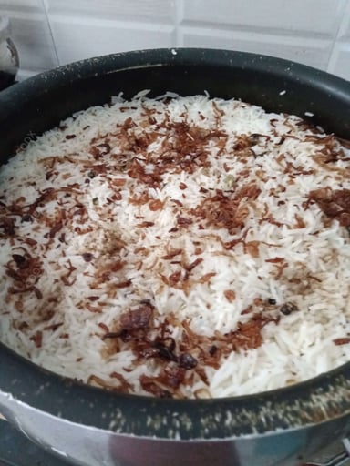 Tasty Mutton Biryani cooked by COOX chefs cooks during occasions parties events at home
