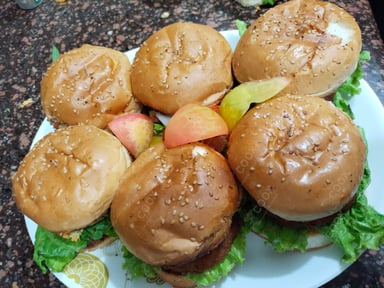 Tasty Mini Veg Burgers cooked by COOX chefs cooks during occasions parties events at home