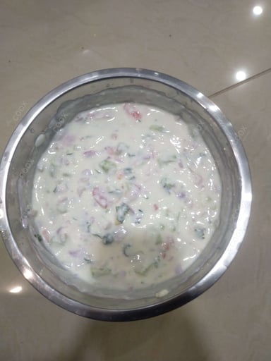 Tasty Cucumber Raita cooked by COOX chefs cooks during occasions parties events at home