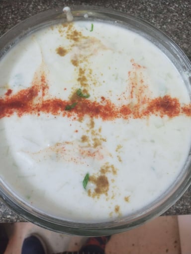 Tasty Cucumber Raita cooked by COOX chefs cooks during occasions parties events at home