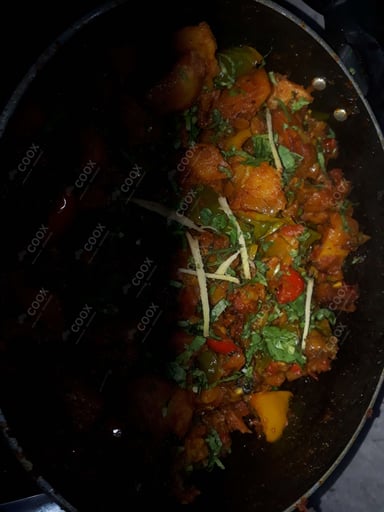 Tasty Aloo Shimla Mirch cooked by COOX chefs cooks during occasions parties events at home