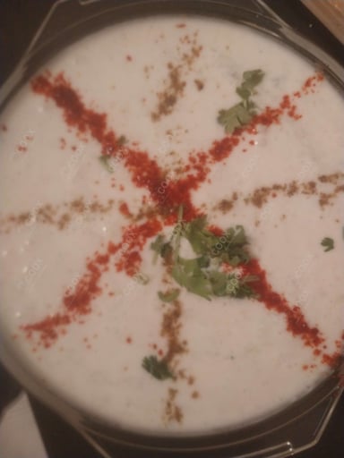 Tasty Cucumber Raita cooked by COOX chefs cooks during occasions parties events at home