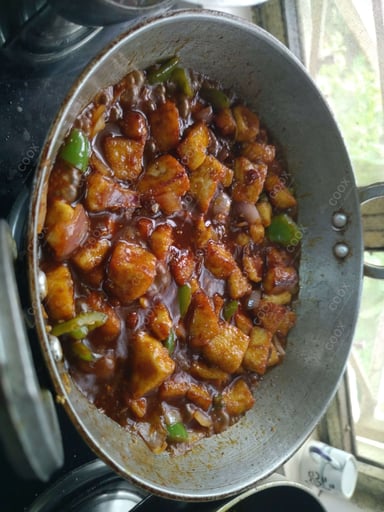 Tasty Chilli Paneer (Gravy) cooked by COOX chefs cooks during occasions parties events at home