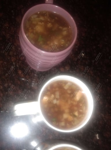 Tasty Vegetable Manchow Soup cooked by COOX chefs cooks during occasions parties events at home