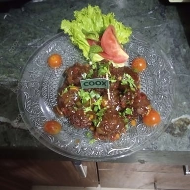 Tasty Veg Manchurian (Dry) cooked by COOX chefs cooks during occasions parties events at home