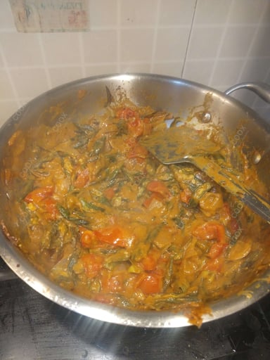 Tasty Bhindi do Pyaza cooked by COOX chefs cooks during occasions parties events at home