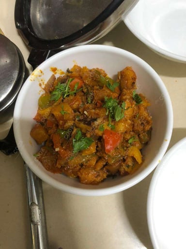 Tasty Aloo Shimla Mirch cooked by COOX chefs cooks during occasions parties events at home