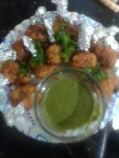 Tasty Chicken Lollipop cooked by COOX chefs cooks during occasions parties events at home