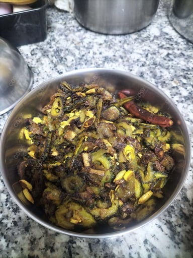 Tasty Karele ki Sabzi cooked by COOX chefs cooks during occasions parties events at home