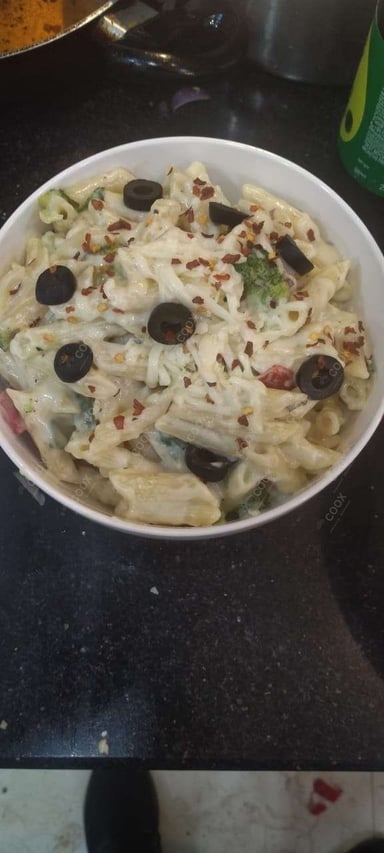 Tasty Pasta in White Sauce cooked by COOX chefs cooks during occasions parties events at home