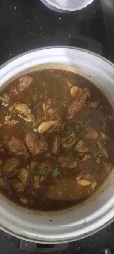 Tasty Chicken In Burnt Garlic Sauce cooked by COOX chefs cooks during occasions parties events at home